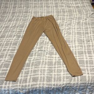 Beige or light brown leggings